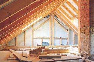 an interior view of a house attic under construction