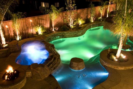 Swiming and spa lit with multi colored fiber optic lighting