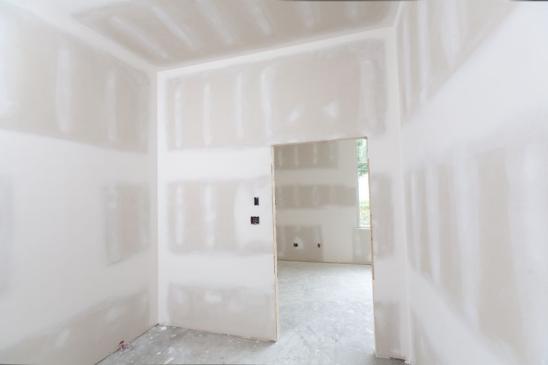 A room that has been drywalled and taped.