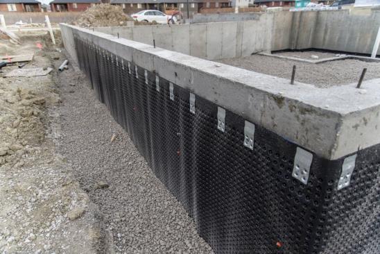 Basement wall waterproofing membrane installed