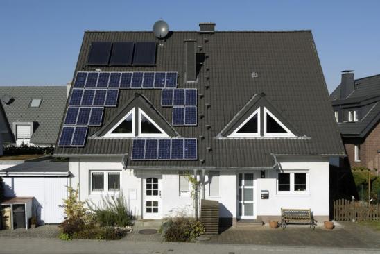 Solar panels on the roof of a two-family house.