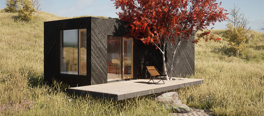 Ein Modulhaus mit kleiner Holzterrasse in freier Natur